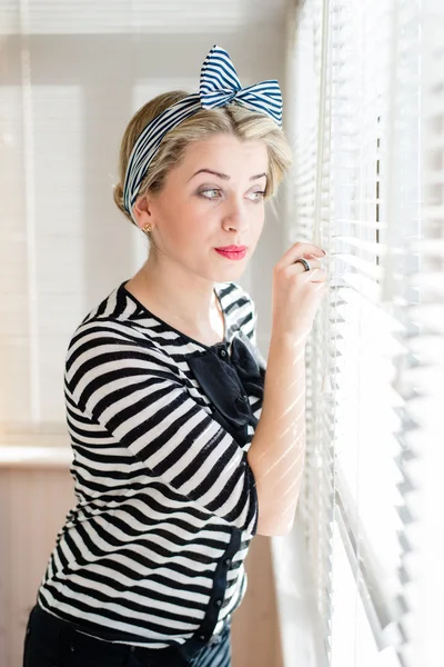 Pinup young woman having fun on the balcony — Stock Photo, Image