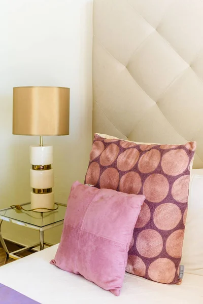 Side Table Golden Lamp Bedroom Pink Pillows — Stock Photo, Image