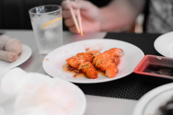 Fish Salmon Cutlets Sauce White Plate Hand Chopsticks Soy Souce — Stock Photo, Image