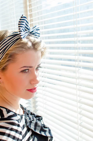 Picture of closeup on beautiful blond young woman pinup girl having fun ... happy smiling & looking  thoughtfully through sun lighted windows — Stock Photo, Image