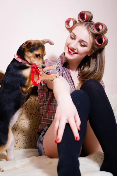 Girl having fun playing with small dog — Stock Photo, Image
