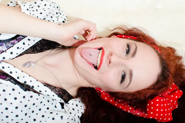 Woman showing tongue — Stock Photo, Image