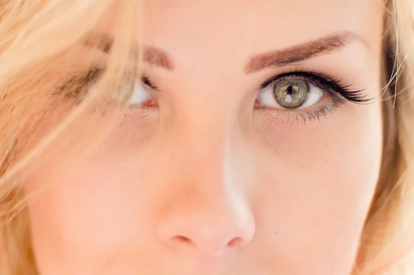 Portrait of gorgeous beautiful blond young lady face with gray or light green eyes looking at camera closeup picture — Stock Photo, Image