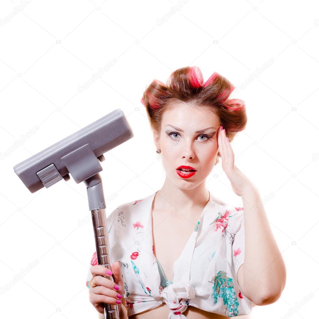 Woman in curlers holding vacuum cleaner Stock Photo by ©rosipro 53641873