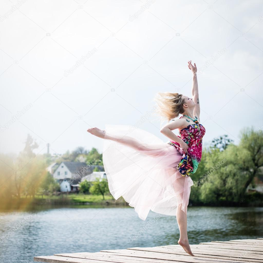 Young woman dancing outdoors