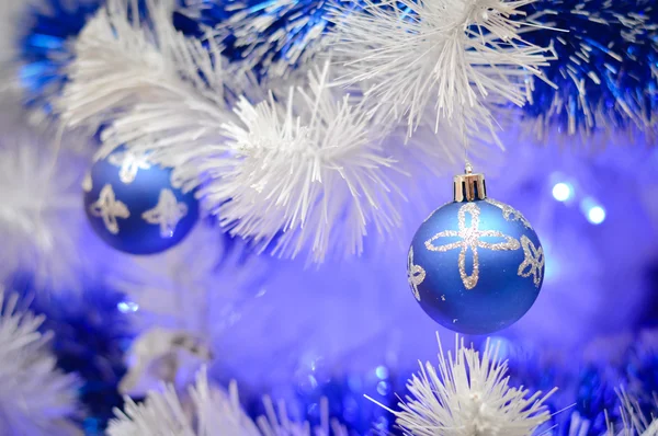 Christmas glass toys on faux pine tree — Stock Photo, Image