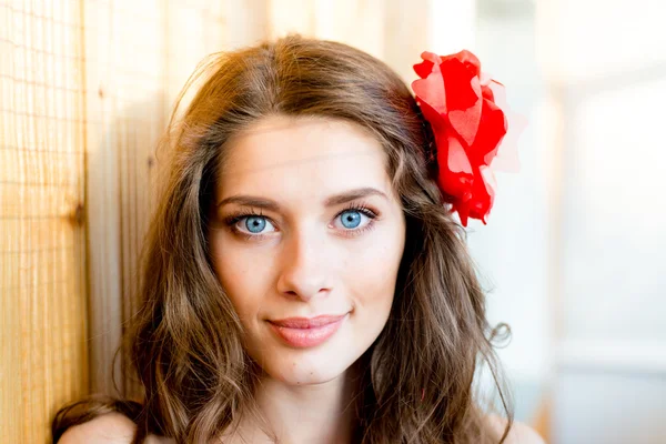 Blue eyes girl on light copy space background — Stock Photo, Image