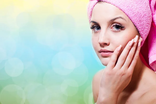 Spa time: blue eyes sexy woman in towel touching her face silk skin & looking at camera on light copy space background, closeup portrait — Stock Photo, Image