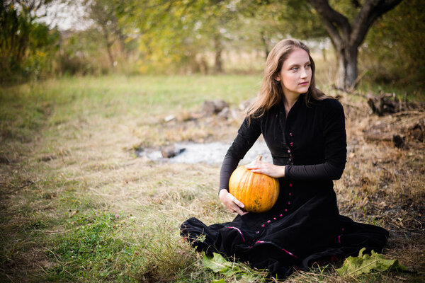 Girl with pumpkin