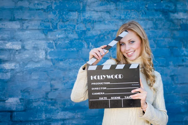 Woman with cinema clapper board — Stock Photo, Image