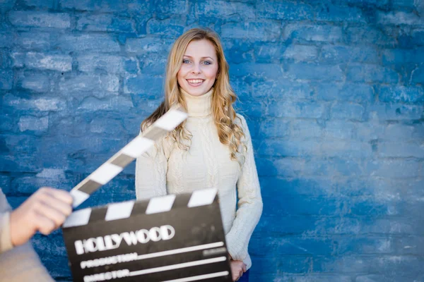 Woman with cinema clapper board — Stock Photo, Image