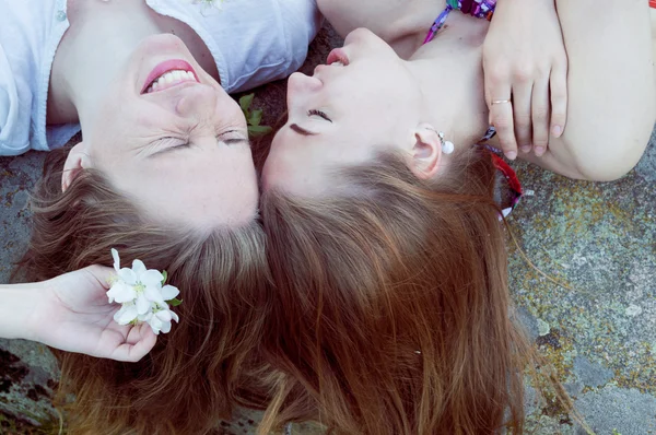 Ladies lying on stone — Stock Photo, Image