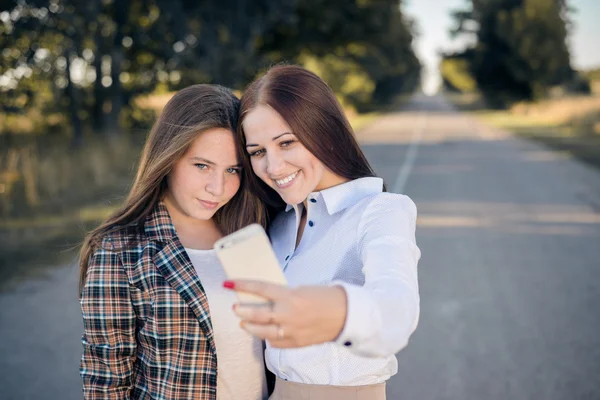 Young ladies making selfie — Stock Photo, Image