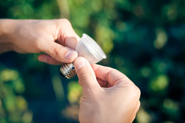 LED lamp in hand — Stock Photo, Image