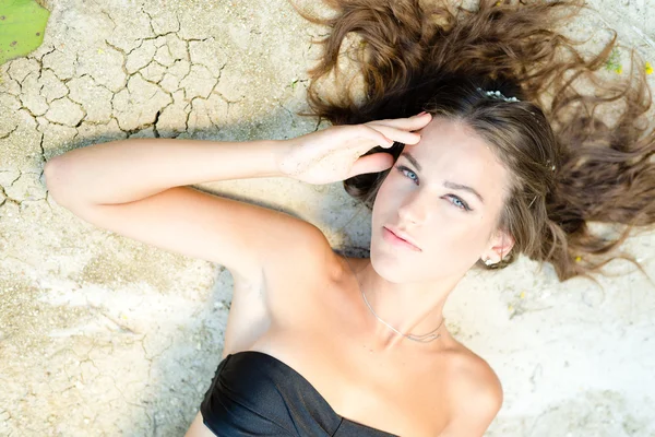 Girl on cracked ground — Stock Photo, Image