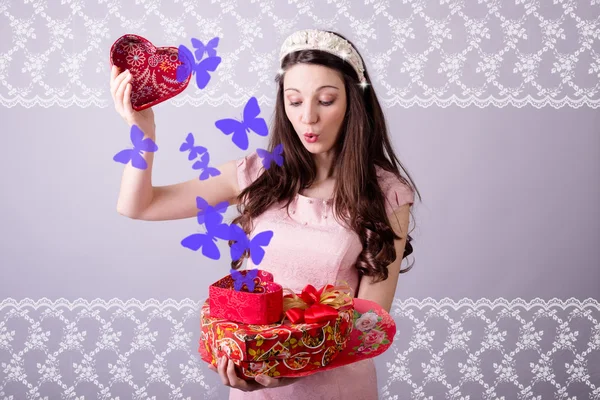 Woman with heart shaped boxes — Stock Photo, Image