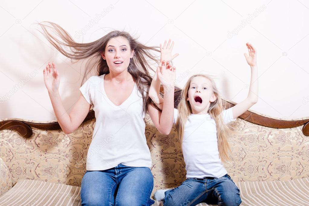 Amazed woman with little girl