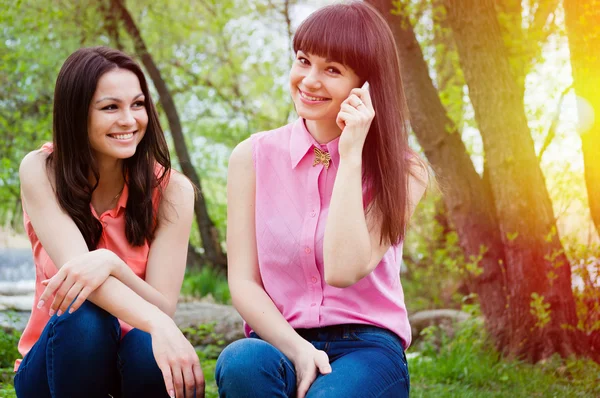 Young girls smiling with cell phone Stock Image