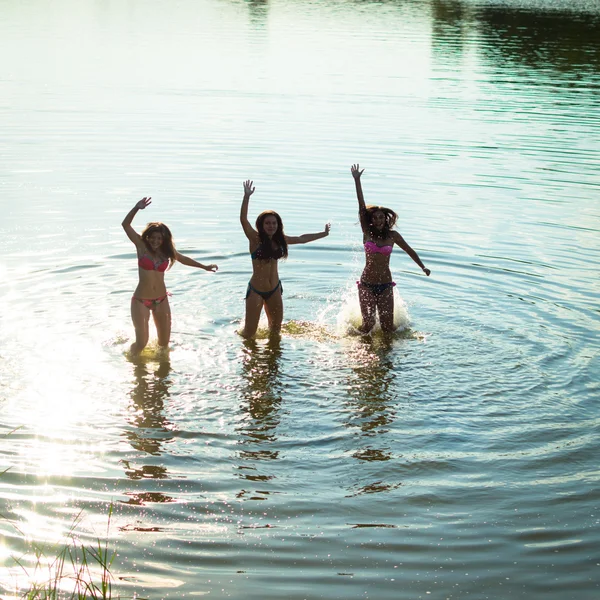 Teenage girls having fun in water — Stock Photo, Image