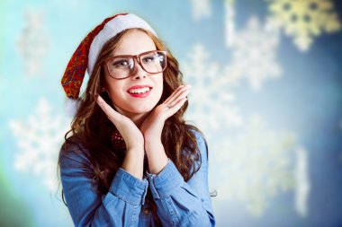 Funny hipster girl in santa hat