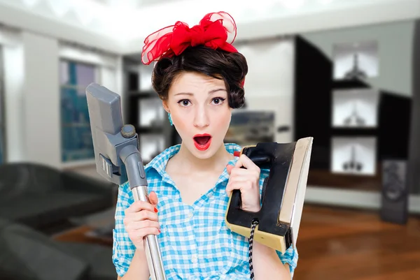 House wife with iron and vacuum cleaner — 图库照片