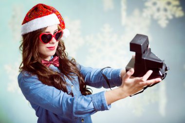 girl making selfie with retro camera