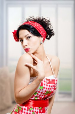 Amazed pinup female wearing apron clipart