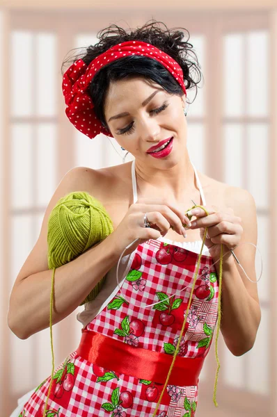 Brunette pinup lady with needlwork — Stock Photo, Image