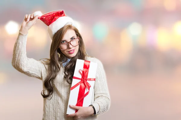 Hipster girl wearing santa hat and glasses — Stockfoto