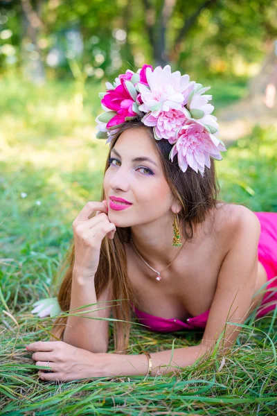 Lady with long hair in wreath relaxing — Stock Photo, Image