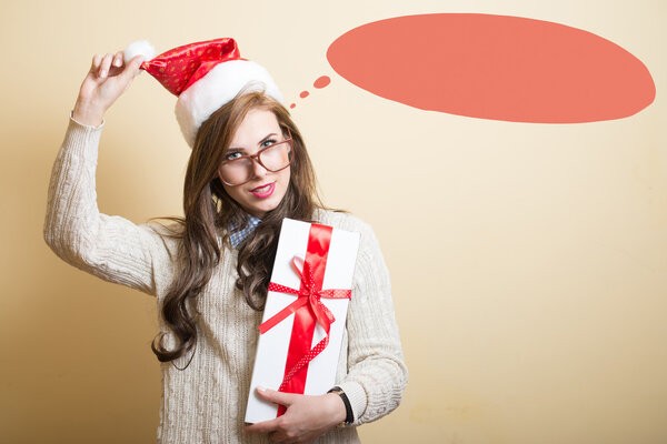 hipster girl in santa hat with present