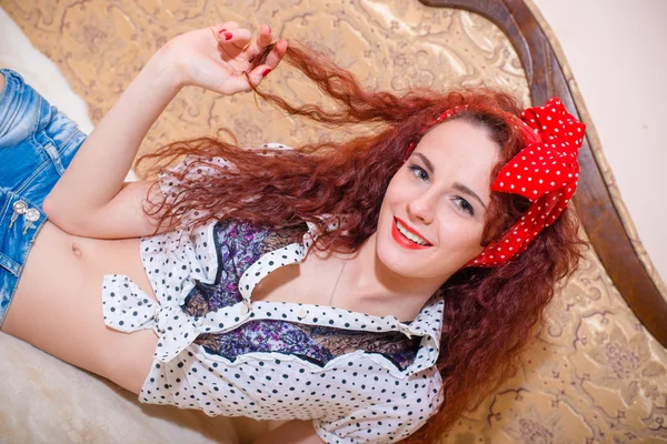 Happy girl playing with her hair — Stock Photo, Image