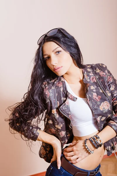 Brunette with long hair in leather jacket — Stock Photo, Image