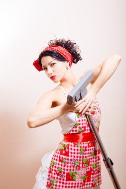 Funny pinup using vacuum cleaner