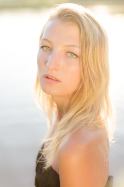 young female on water background