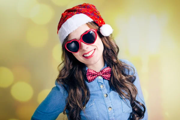 Teenage girl in Santa hat and sunglasses — Stok fotoğraf