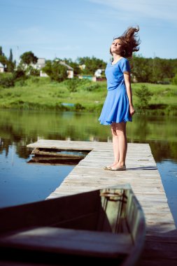 Excited brunette girl on bridge