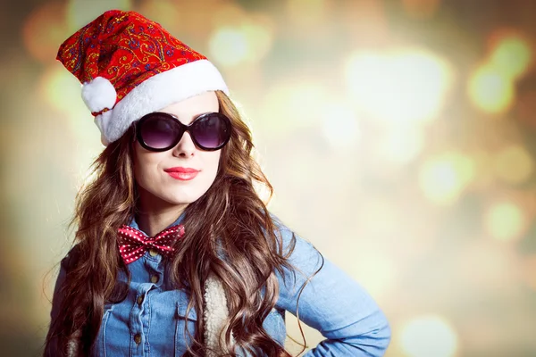 Female in Christmas hat and sunglasses — Stock Photo, Image