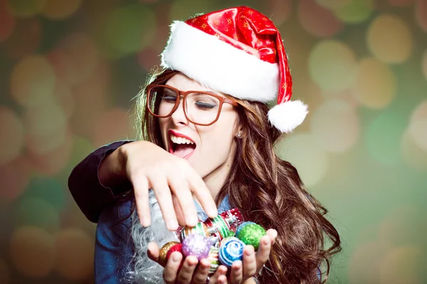 Female in Santa hat and glasses — Zdjęcie stockowe