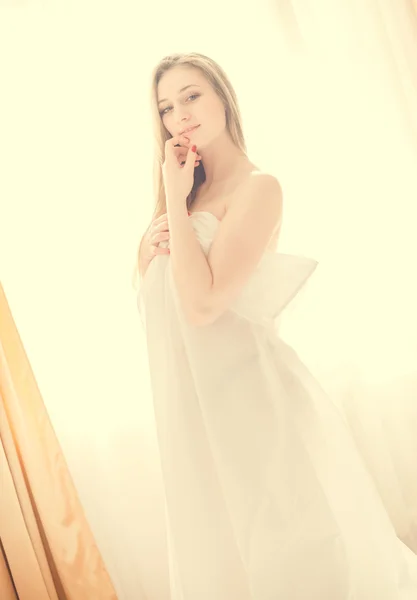 Sexy young pretty lady in white — Stock fotografie