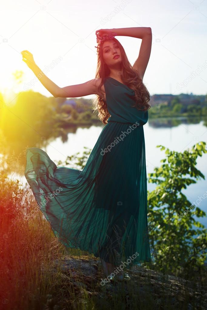 Romantic dancing woman in long dress