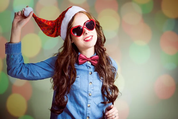 Girl in sunglasses and Santa hat — Stok fotoğraf