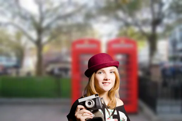 Girl making photo on London street — Stock Photo, Image