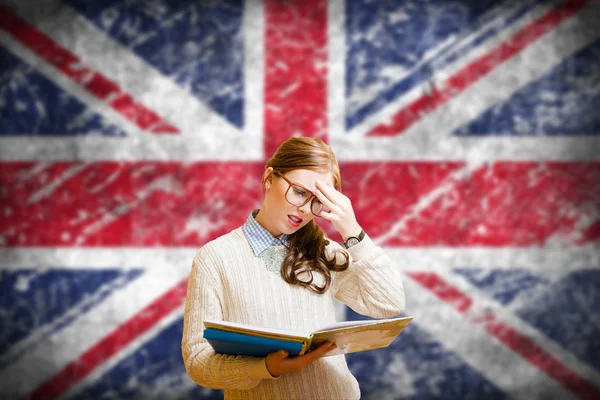 Student girl on english union jack blurred background — Stock Photo, Image