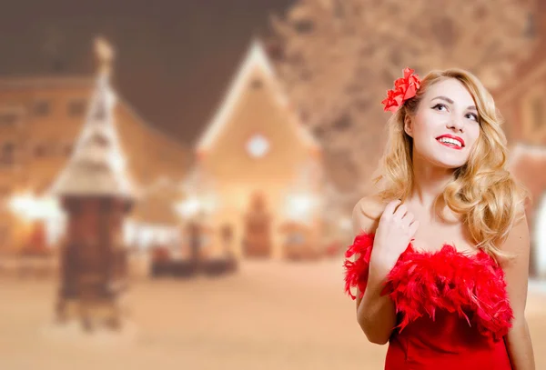 Pretty girl excited in dress on winter night urban background — Zdjęcie stockowe