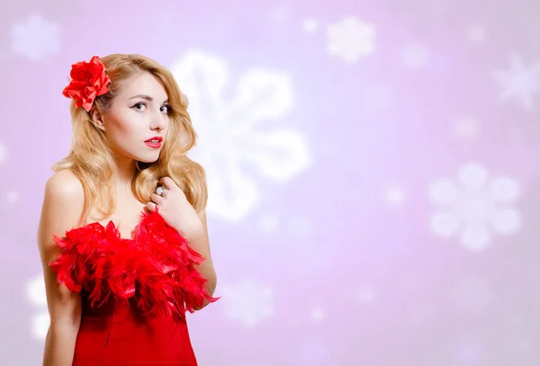 Pretty girl in dress on blurred digital snowflakes blue background — 图库照片