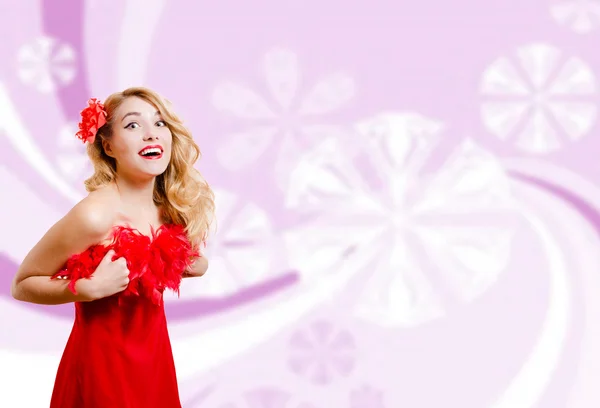 Pretty girl in red dress on blurred digital pink background — 图库照片