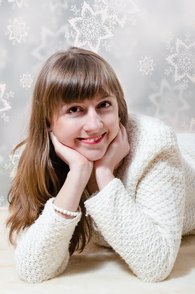 Young woman in white sweater — Stock Photo, Image