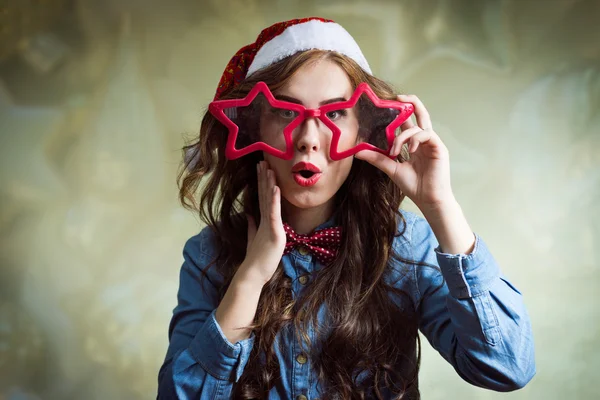 Exciting funny hipster beautiful young lady in santa hat — Stock Photo, Image