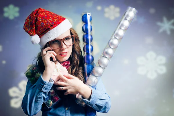 Funny girl wearing xmas santa hat and beard calling mobile - Stok İmaj